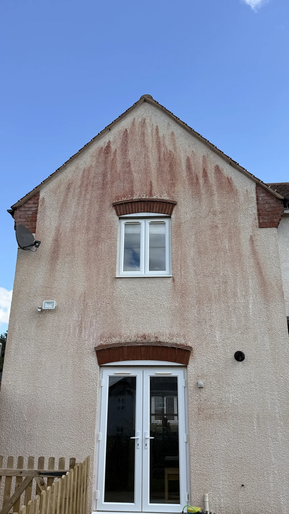 Exterior render before cleaning